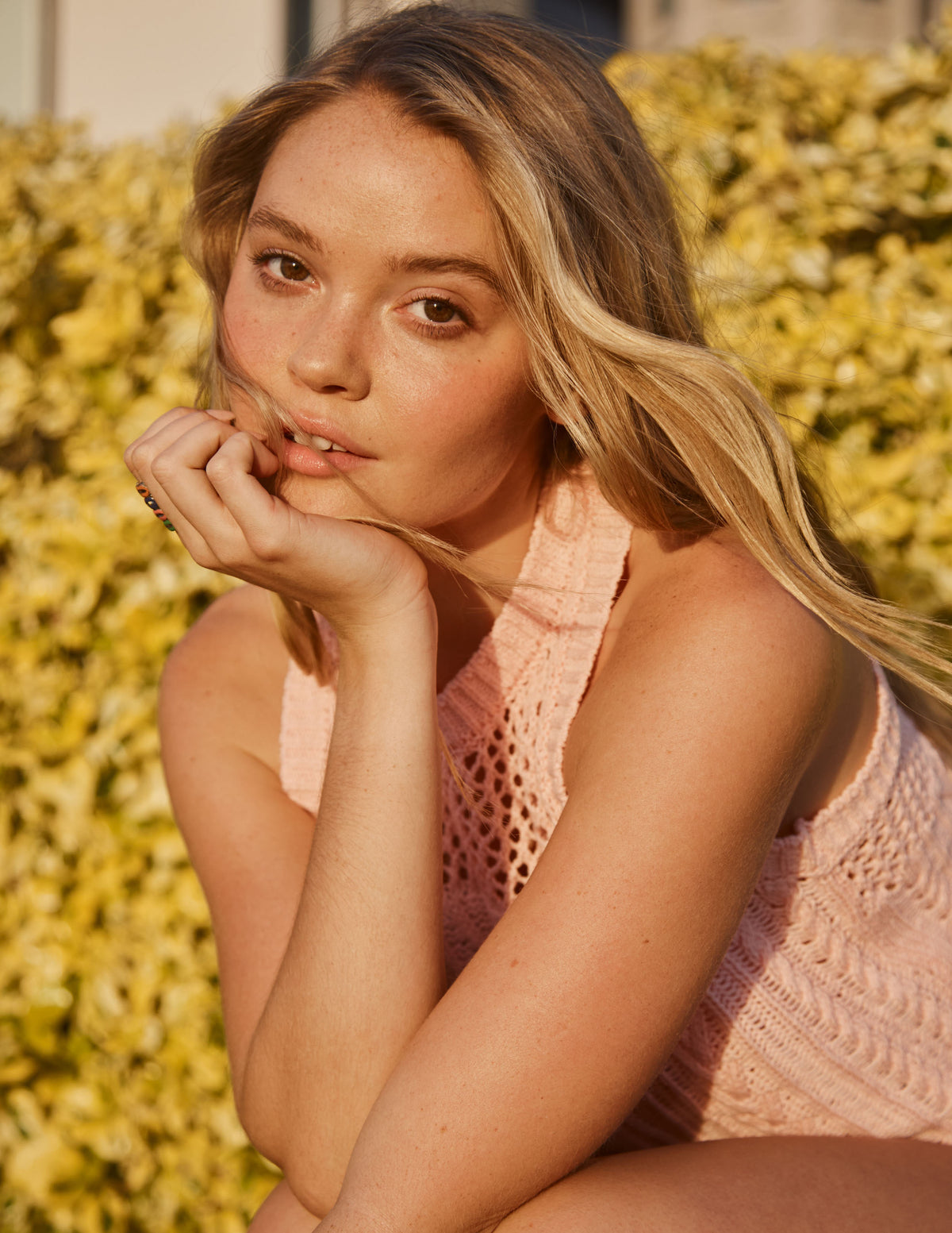 Sundry Racerback Sweater in Candy-model is holding her face up with her hand (close up)