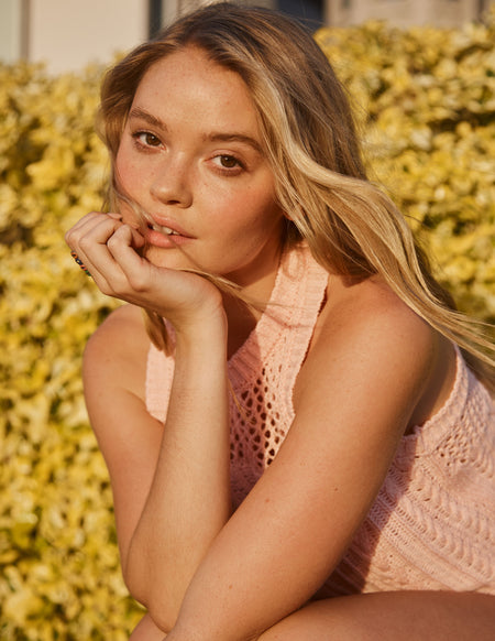 Sundry Racerback Sweater in Candy-model is holding her face up with her hand (close up)