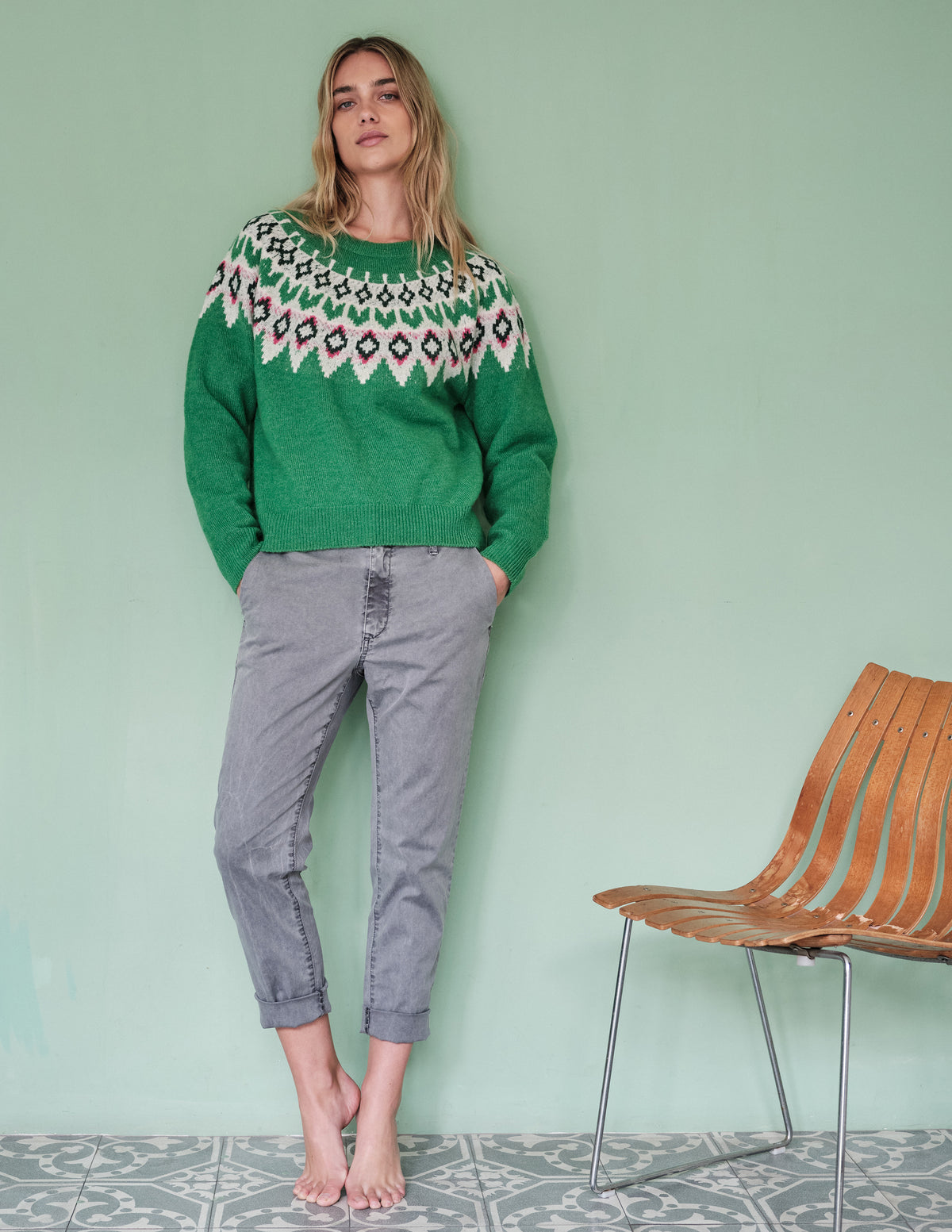 Sundry FairIsle Crew Sweater in Jade-model standing in front of a green wall