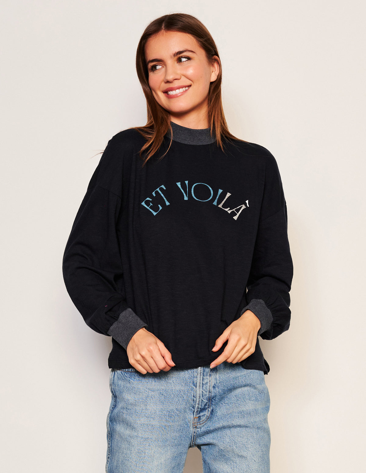 Sundry Et Voila Mock Neck Long Sleeve Tee in Deep Navy-model is looking away and smiling