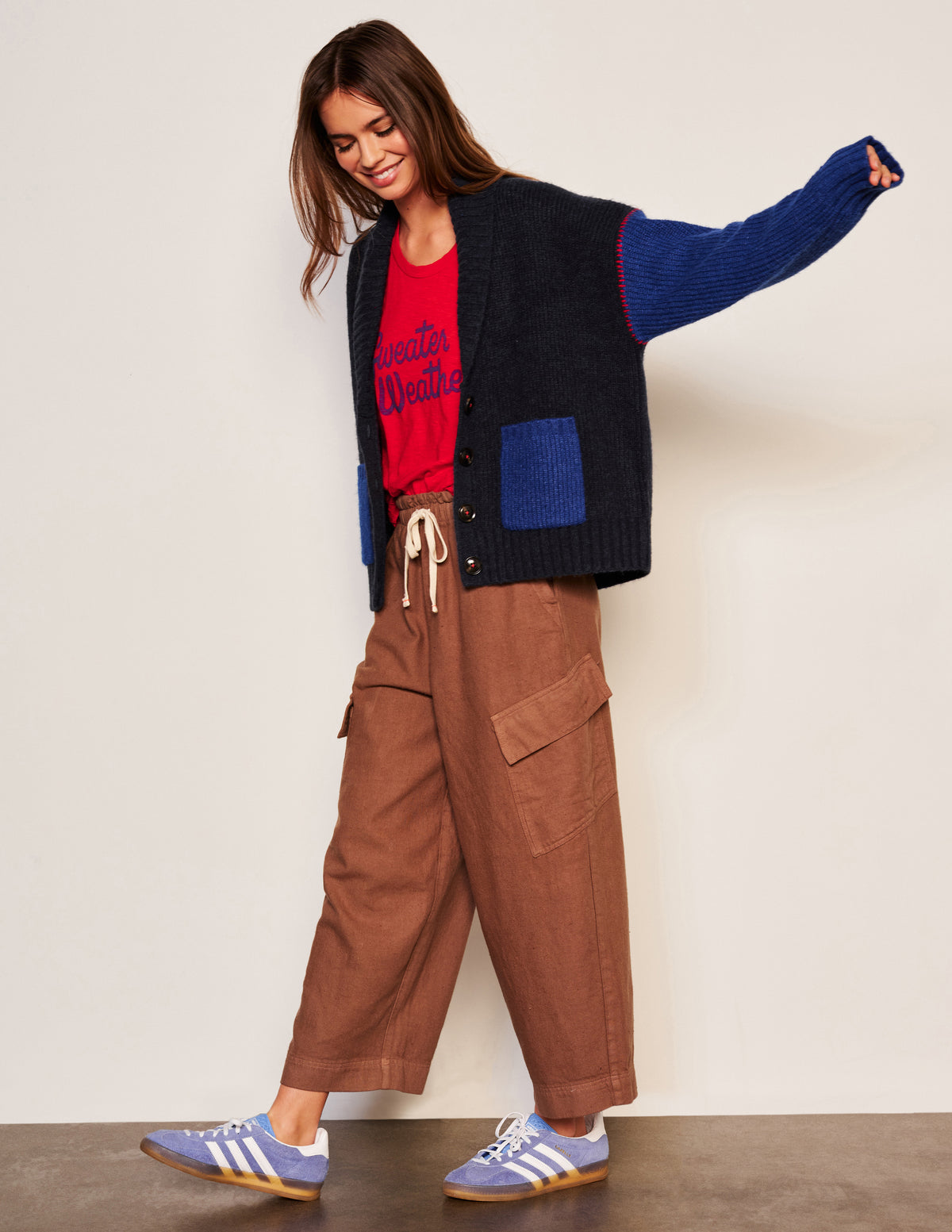 Sundry Shawl Collar Cardi in Deep N-model full view and her hand is looking out