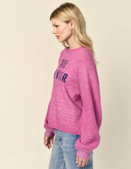 Sundry Au Revoir Insarsia Sweater in Fuscia Gem-model hands are by her side and she is smirking 