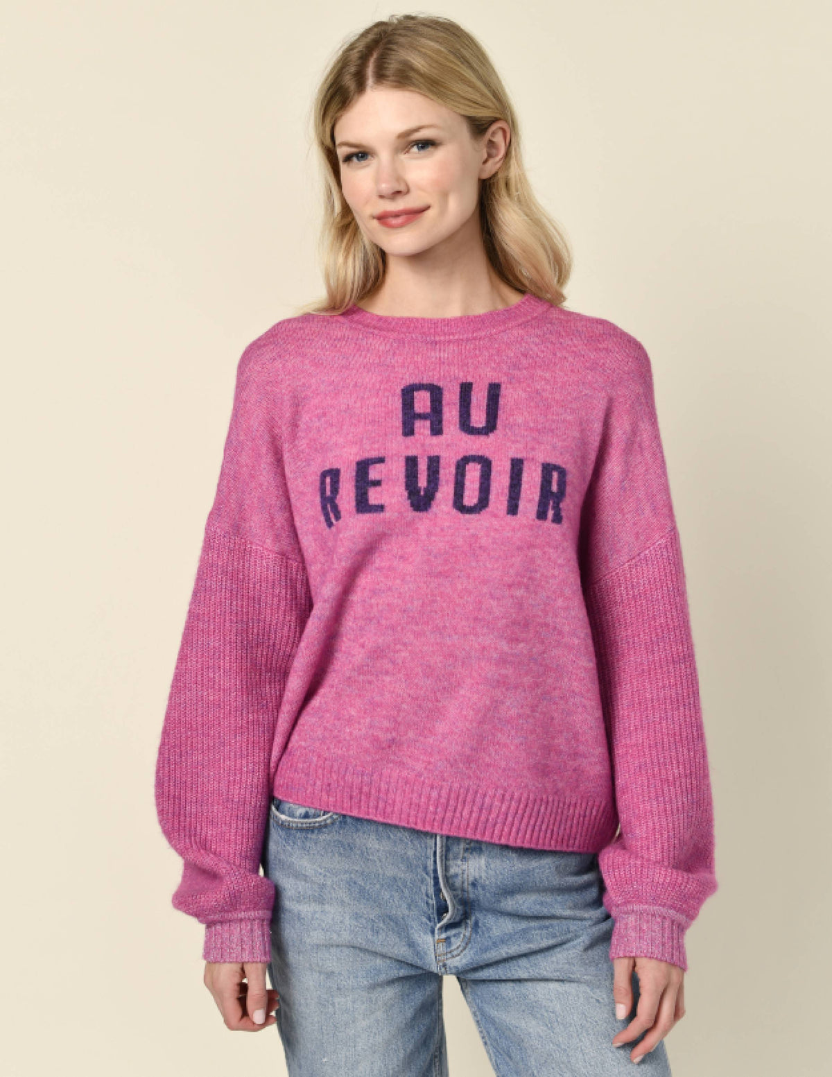 Sundry Au Revoir Insarsia Sweater in Fuscia Gem-model hands are by her side and she is smirking 