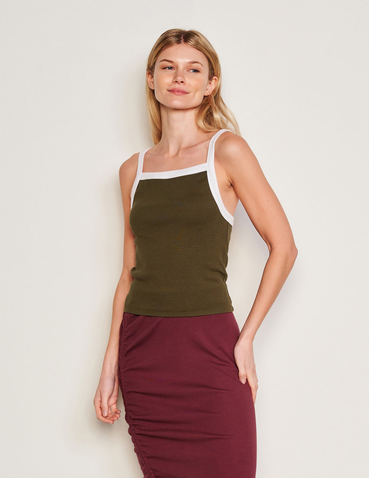 Sundry Ringer Apron Tank in Olive-3/4 front view model is looking off and smiling ]