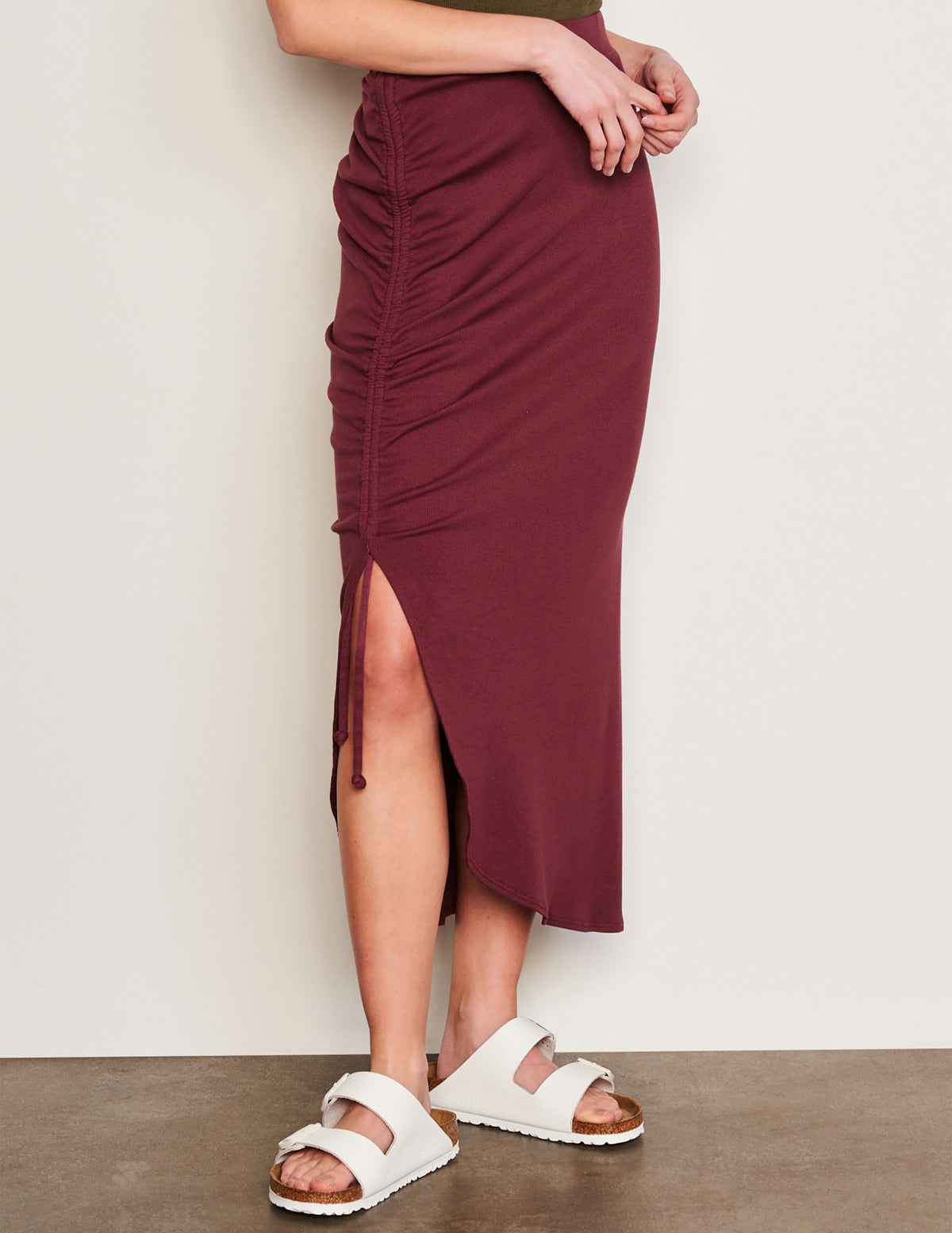 Sundry Shirred Midi Skirt in Merlot-side view of slit in skirt