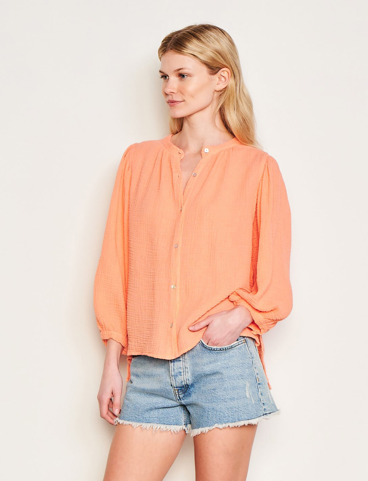 Sundry Free Spirit Shirt in Pink-side view model has her hands in her pocket 