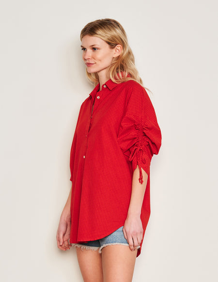 Sundry Beachside Check Short Shirt Dress in Burnt Red-model has her hands behind her back 3/4 front view