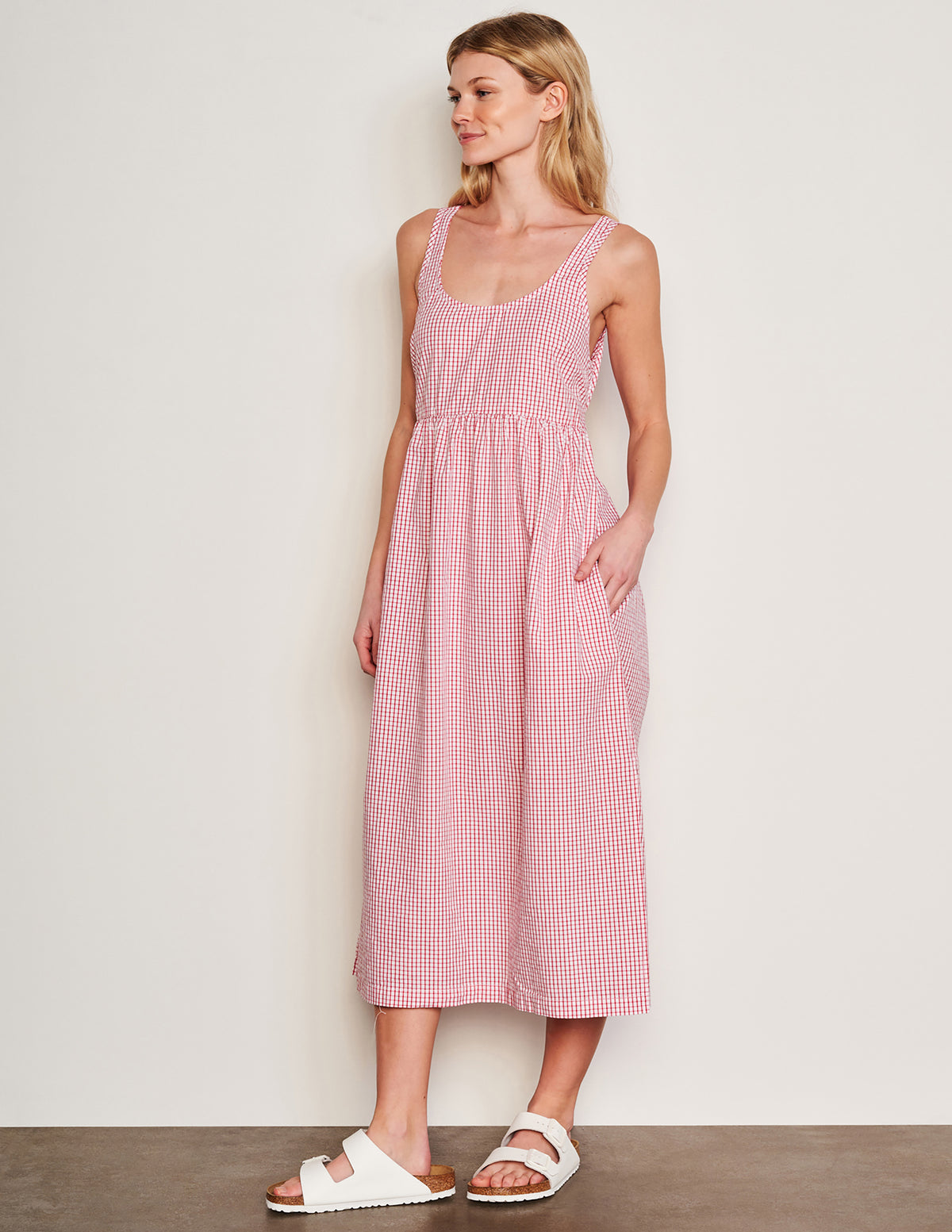 Sundry Beachside Check Midi Tie Back Dress in Optic White-model has her hands in her pocket and is looking away 